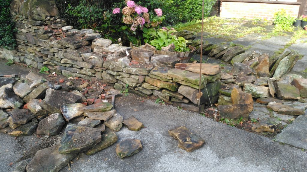 A dry stone repair in Longridge before pic.