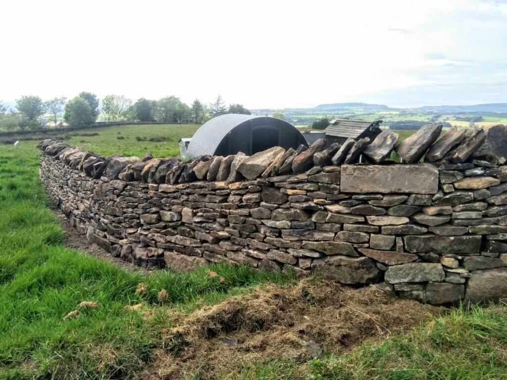 shows a farm gate entrance near Longridge in Lancashire, built from dry stone wall.