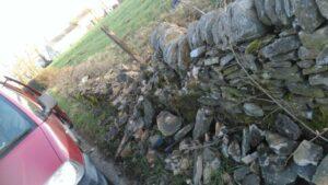 picture of a car damaged dry stone wall for farmer in osbaldeston, lancashire